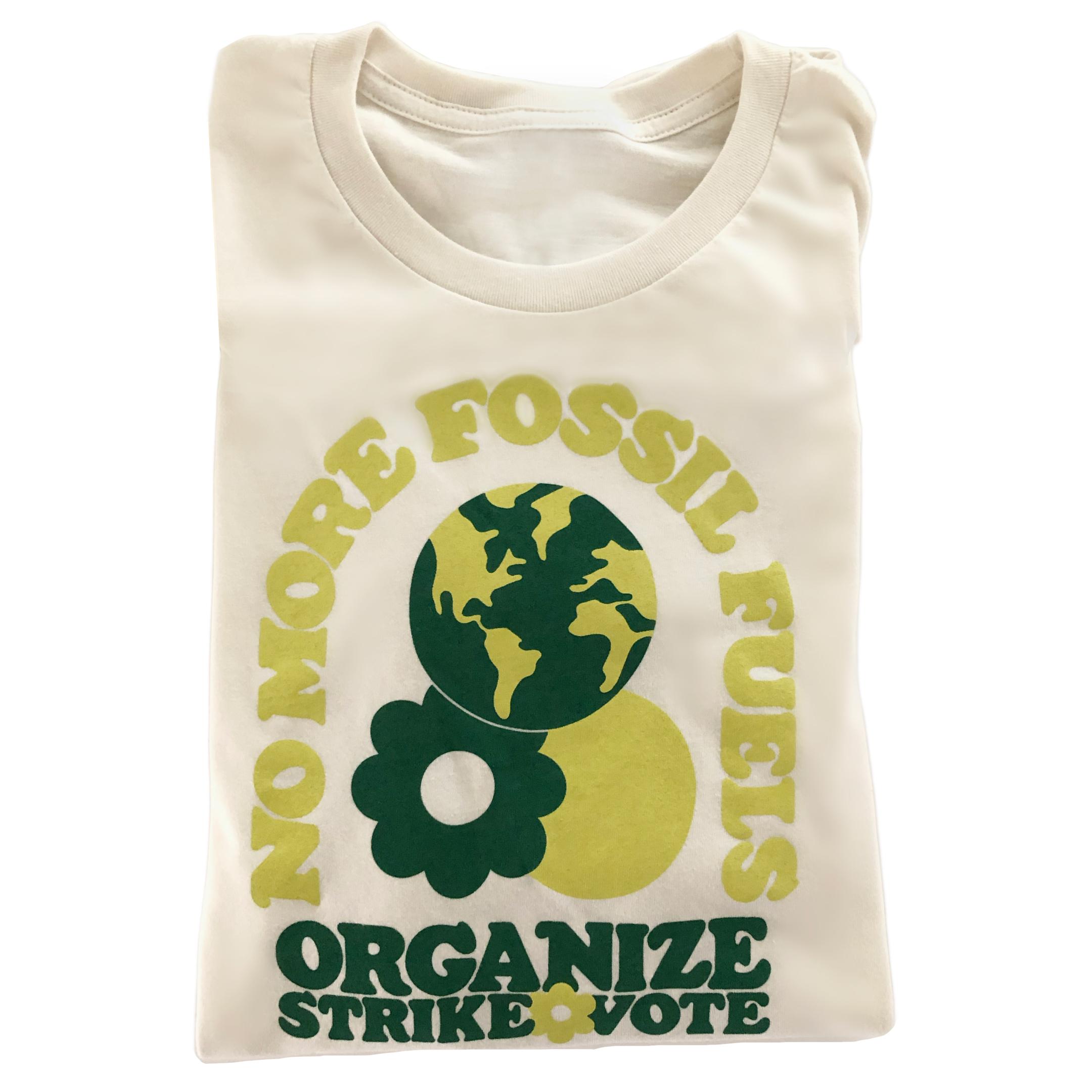 
              Off-white t-shirt with green text folded into a rectangle.
              The design says “No more fossil fuels” in an arch
              and then underneath it reads “Organize, Strike, Vote.”
              There is an illustration of the earth, sun and a daisy also.
            